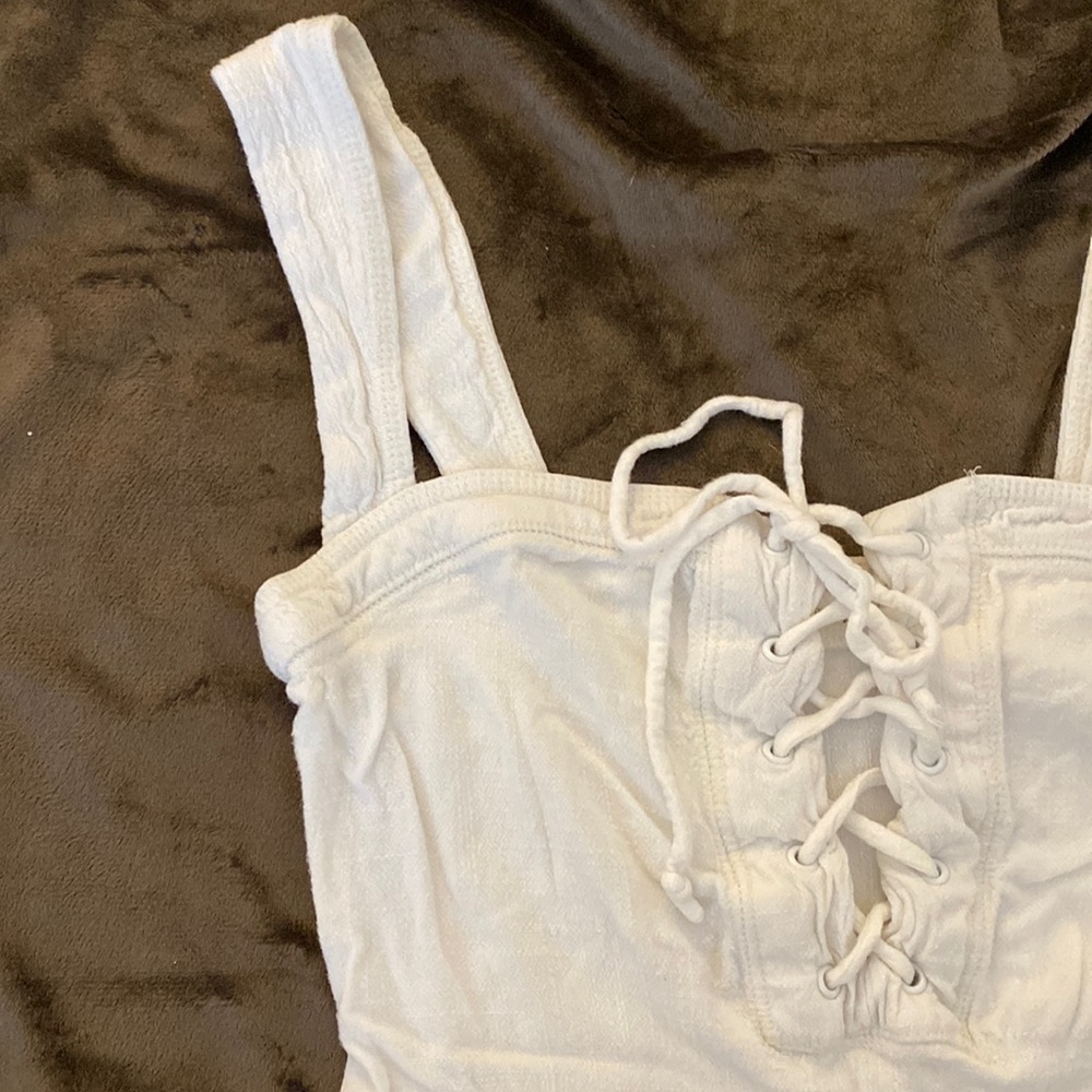 Free People Bodysuit with Lace up top. Size XS.